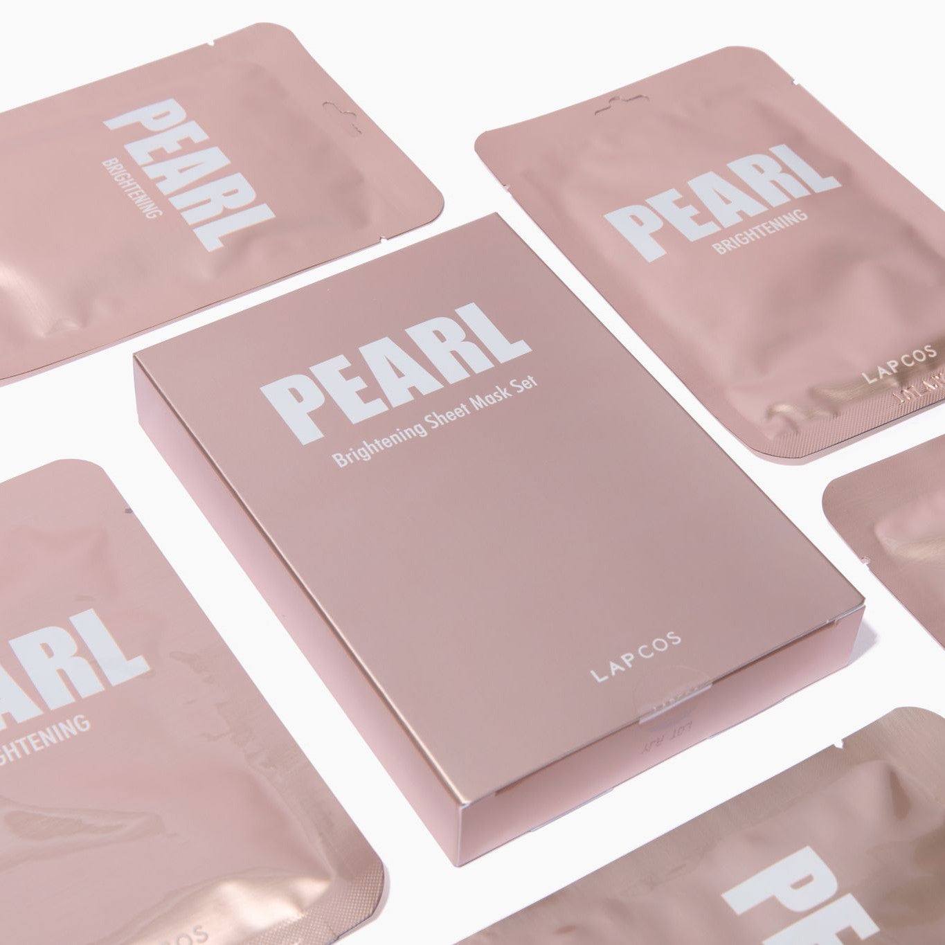 Box of PEARL brightening sheet masks with pouches surrounding it
