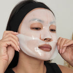 Woman applying LAPCOS overnight face mask in two parts